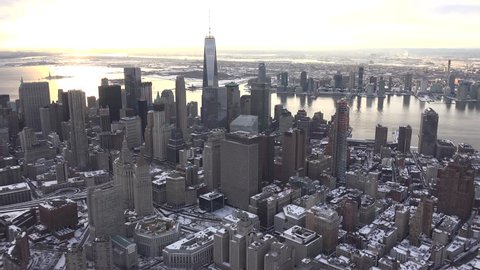 New York City, Downtown Manhattan, WINTER SUNSET 4k aerials post January Blizzard, 2016. Shot from photo aircraft, open window, no plastic. Stock video