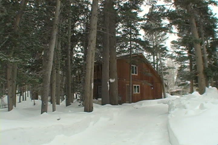 A cozy cabin in the eastern sierras as it snows.