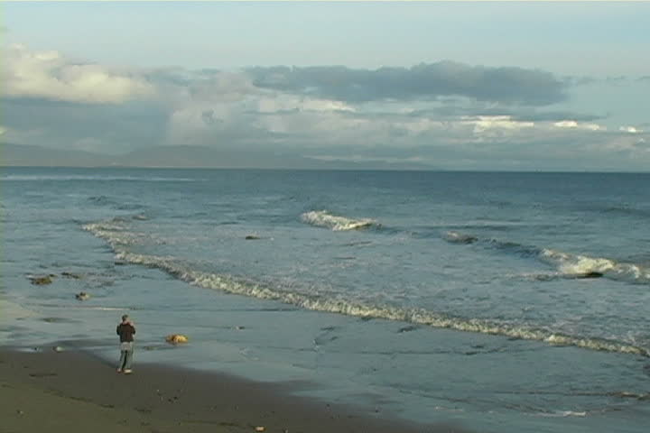 A man photographs the Pacific.