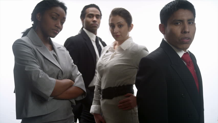 A mix of African and Hispanic men and women perform tasks and have meetings in