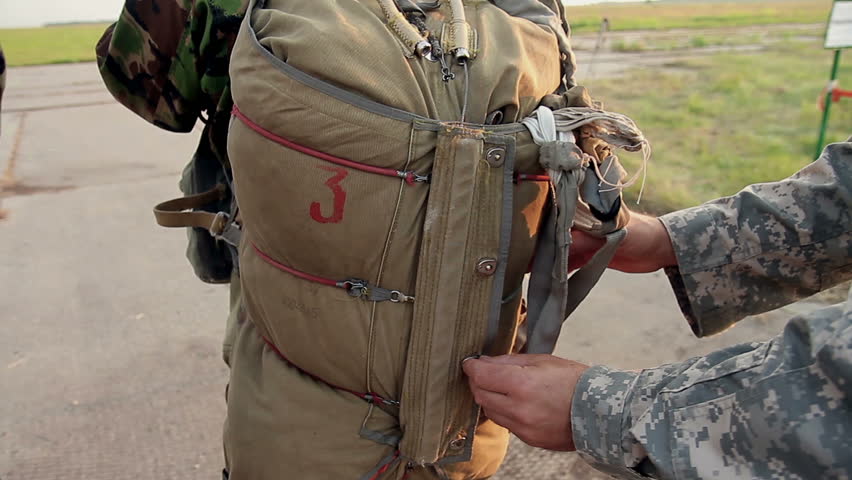 Closeup of marines packing backpacks and parachutes before operation Royalty-Free Stock Footage #14267087