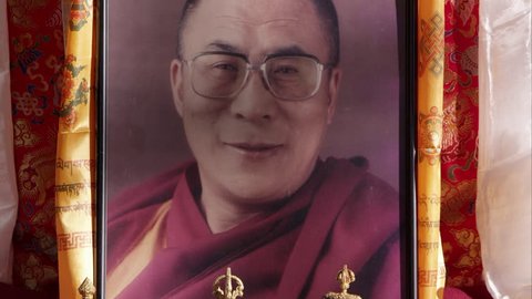 Salt Lake City, Utah - CIRCA October 2015 - Tilting down shot of a portrait of the Dalai Lama