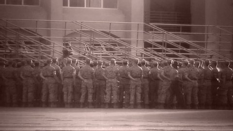 Archival shot of Marines standing at ease
