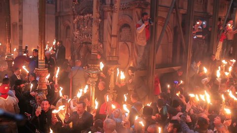 JERUSALEM, ISRAEL - APRIL 11:Christians participating at Miracle of Holy Fire in Easter Day.The Holy Fire is an immaterial  fire that comes every year in Jerusalem in Holy Sepulcher at orthodox Easter