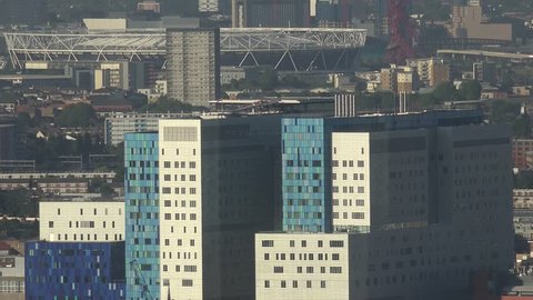 4K Aerial view of famous London stadium and town architecture with modern block design by day  