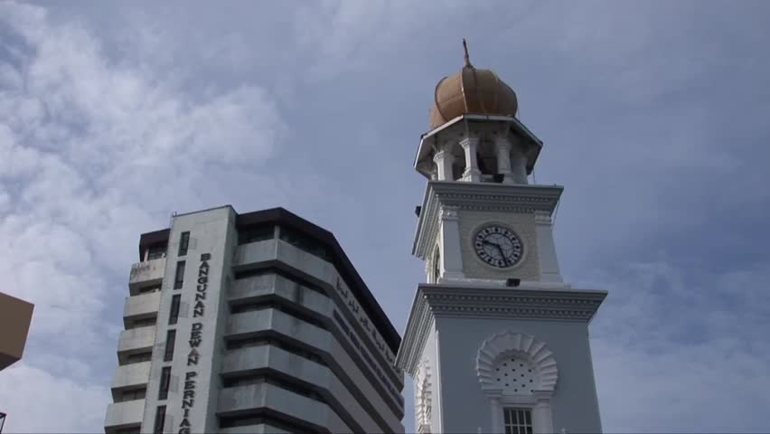 Tilt down the clock tower in Penang Malaysia. Shot looking twards sky