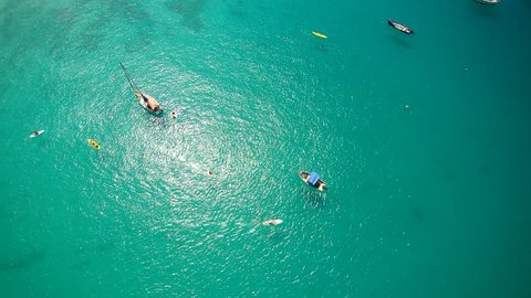 Aerial view of clear ocean waters along a tropical Beach featuring boats and Yachts in Barbados in the Caribbean 