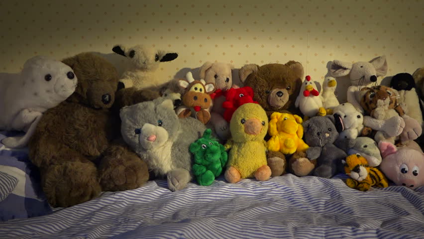 bed full of teddy bears