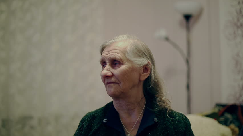 Grandma tv. Sad grandmother. Sad grandma. Portrait Happy crying in Joy.
