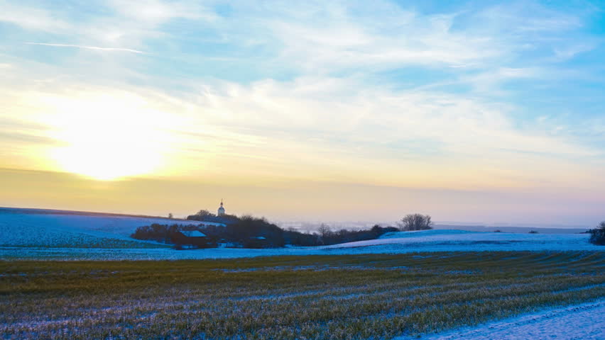 Timelapse of a sunset over a winterly landscape in a rural environment in Germany, Europe.
 | Shutterstock HD Video #14309986