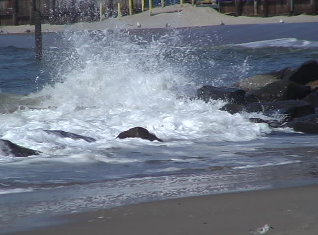 Waves crashing on coast.