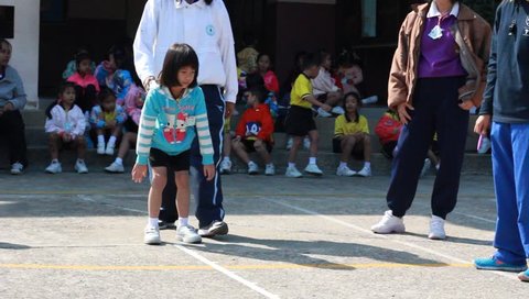 BANGKOK, THAILAND - JAN 26, 2016: Unknown children, long jump, kindergarten Students are studying Physical Education in Schools at kindergarten School. Pieamsuwan school in bangkok at 2016.