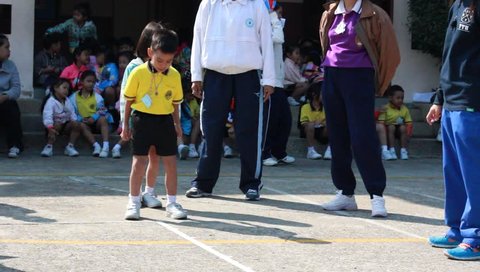BANGKOK, THAILAND - JAN 26, 2016: Unknown children, long jump, kindergarten Students are studying Physical Education in Schools at kindergarten School. Pieamsuwan school in bangkok at 2016.