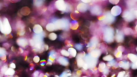 Abstract color bokeh circles background in violet tones, loop ready