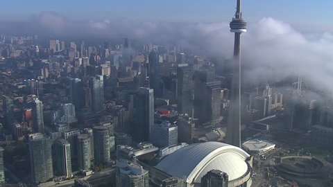 The iconic CN Tower dominates the skyline on a misty early morning