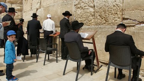 JERUSALEM, ISRAEL - April 10, 2015: Jerusalem western wall. The Western Wall or the Wailing Wall is the remaining wall of King Solomon temple where orthodox jews are praying.