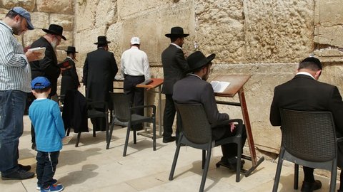 JERUSALEM, ISRAEL - April 10, 2015: Jerusalem western wall. The Western Wall or the Wailing Wall is the remaining wall of King Solomon temple where orthodox jews are praying.