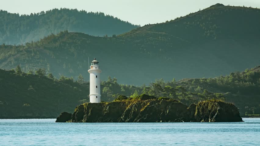 Lighthouse in a Mediterranean cove on Turkish shore land