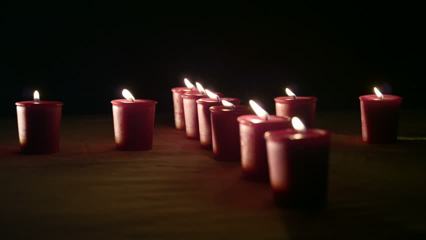 Red & White Candles in the shape of a heart and a cross against white and black