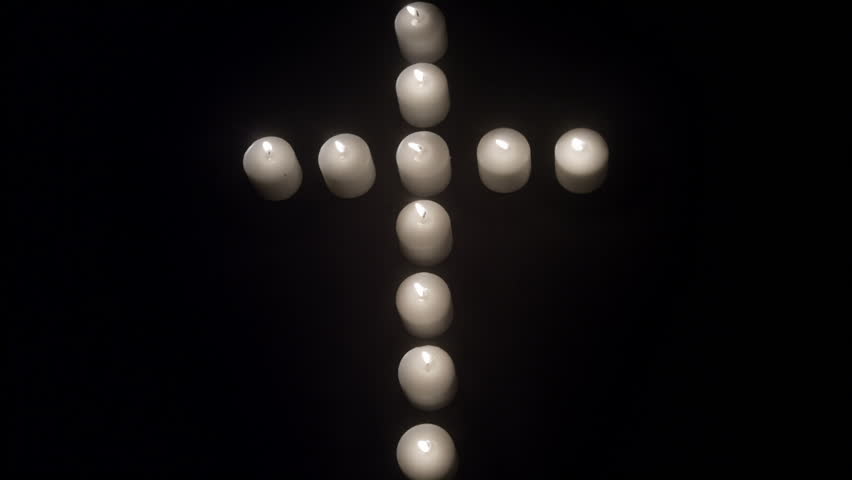 Red & White Candles in the shape of a heart and a cross against white and black