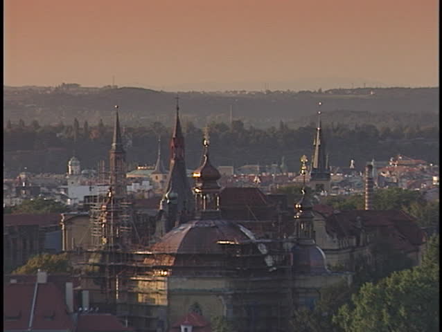 Beautiful spires rest above a crowded city skyline.