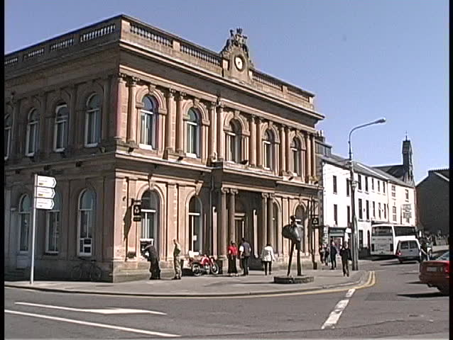An old building adorns a street corner in Ireland.