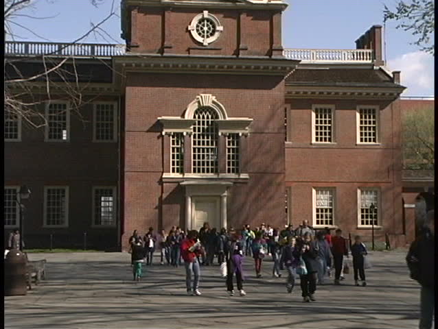 Tourists walk through the courtyard in front of Independence Hall in Philadelphia.