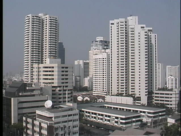 Skyscrapers tower high above the city streets of Bangkok, Thailand.