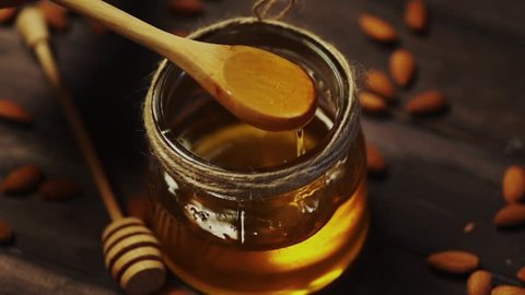 Honey and nuts in slow motion