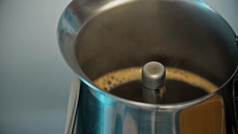 Coffee boiling in mocha precolator