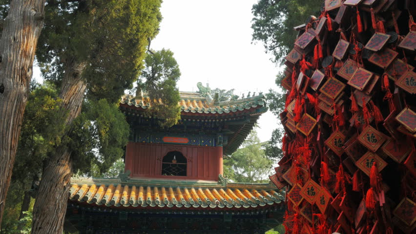 close up of the bell tower inside beihai park, beijing and wooden fu