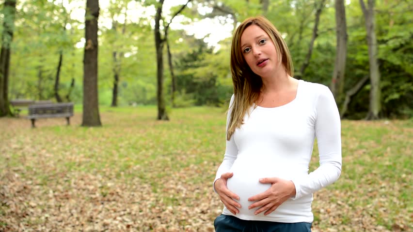 young happy pregnant woman agrees smiles: стоковое видео (без лицензионных ...