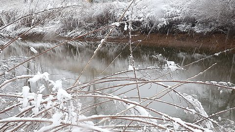 Heavy snow on the river. Winter weather  frozen landscape nature