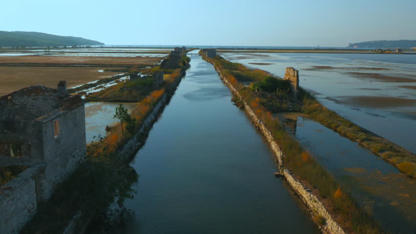 Aerial, along the salt pans canal and ruins