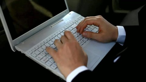 Typing on laptop keyboard in car