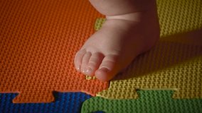 Close up Video of Caucasian Baby Boys feet under a Bouncy chair and Bouncing