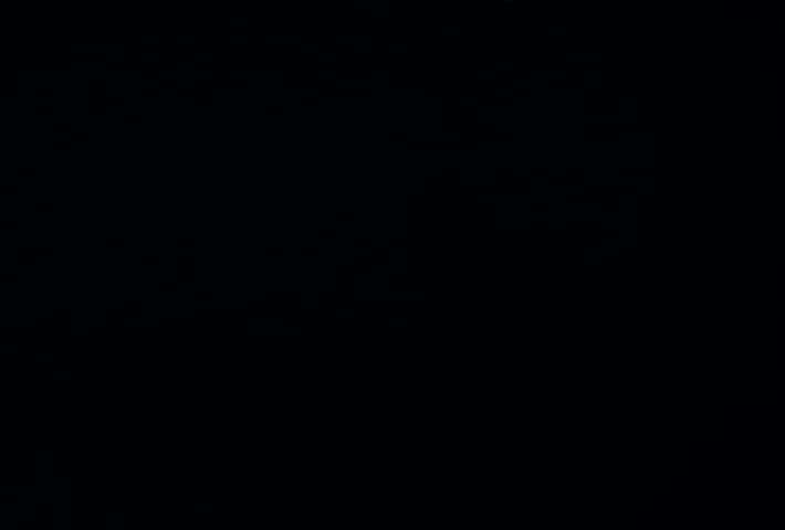 Grey ink in black water