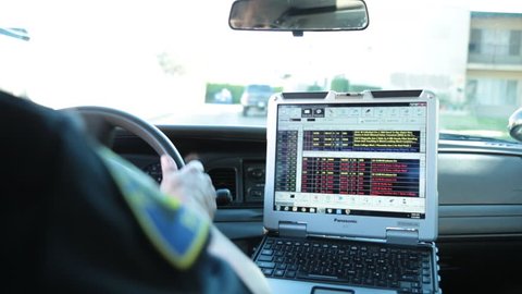 Anaheim, CA., January 2016: POV of Police Car Laptop as Officer Drives his Patrol Car