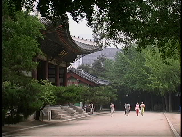 Pedestrians stroll near the Doeksugnung Palace in Seoul, South Korea.