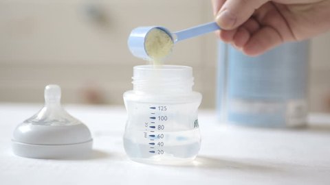 Shot of Preparation of infant milk formula for a baby