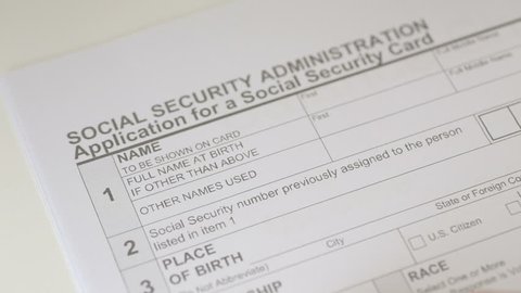 Man filling out Social Security Application Forms