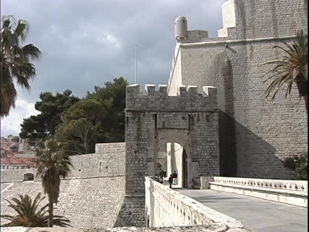 Pan-left of a castle on the Dubrovnik coastline in Croatia.