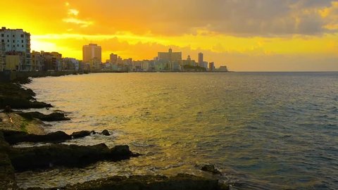 Cuba, Havana, Centro Habana, the Malecon, Vedado skyline at sunset