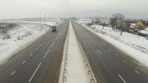 Aerial shot of highway with cars in winter