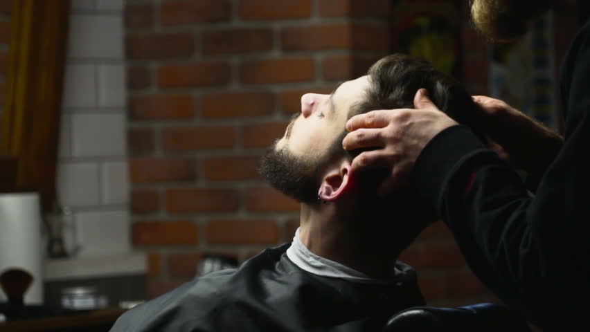 Barber checks his work slow motion | Shutterstock HD Video #14456584