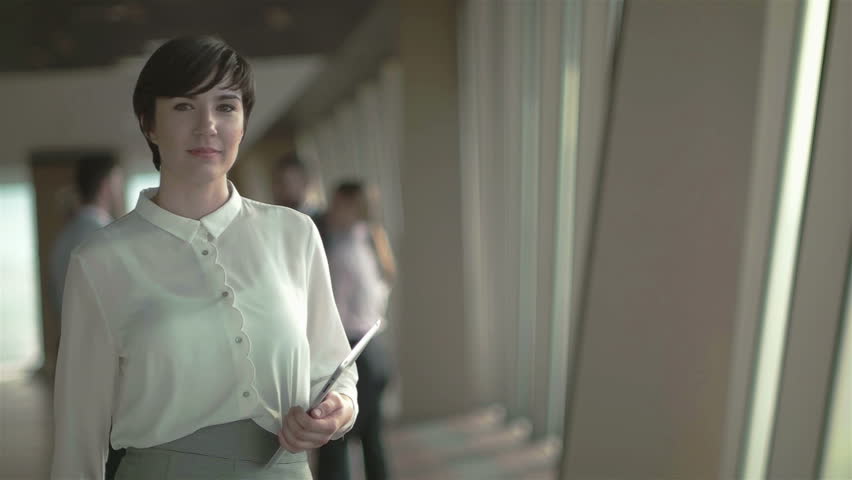 business people group,  females as team leaders standing together  in modern bright office interior