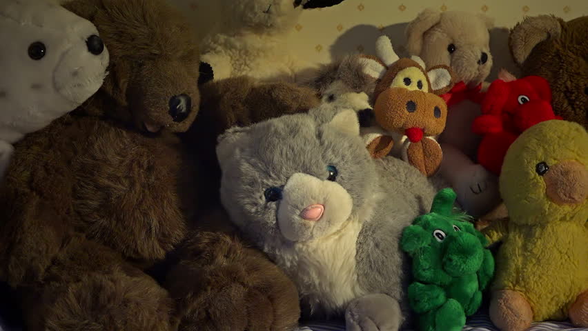 stuffed animals on bed