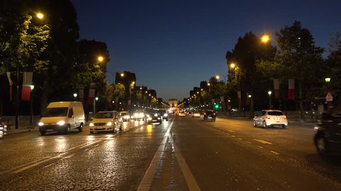PARIS, FRANCE, JULY 18, 2015 4K Triumph Arch Night Traffic Paris Traveling Illuminated Champs Elysees France