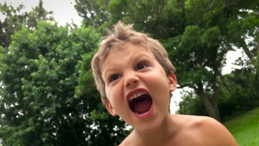 Young boy yelling from the top of his lungs during holiday vacations / ultra slow motion clip in 120 fps Royalty-Free Stock Footage #14464933
