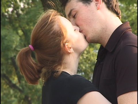 young couple kisses
